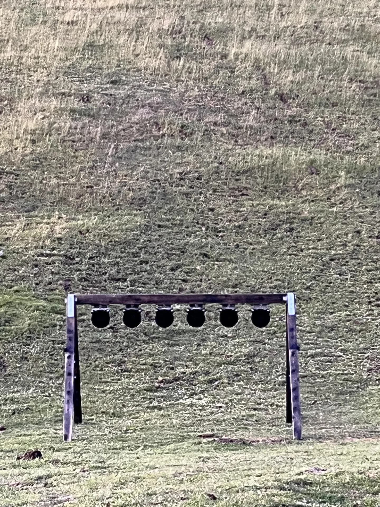 A Lorco falling-plate rack on the range, with six circular plates on a steel frame.