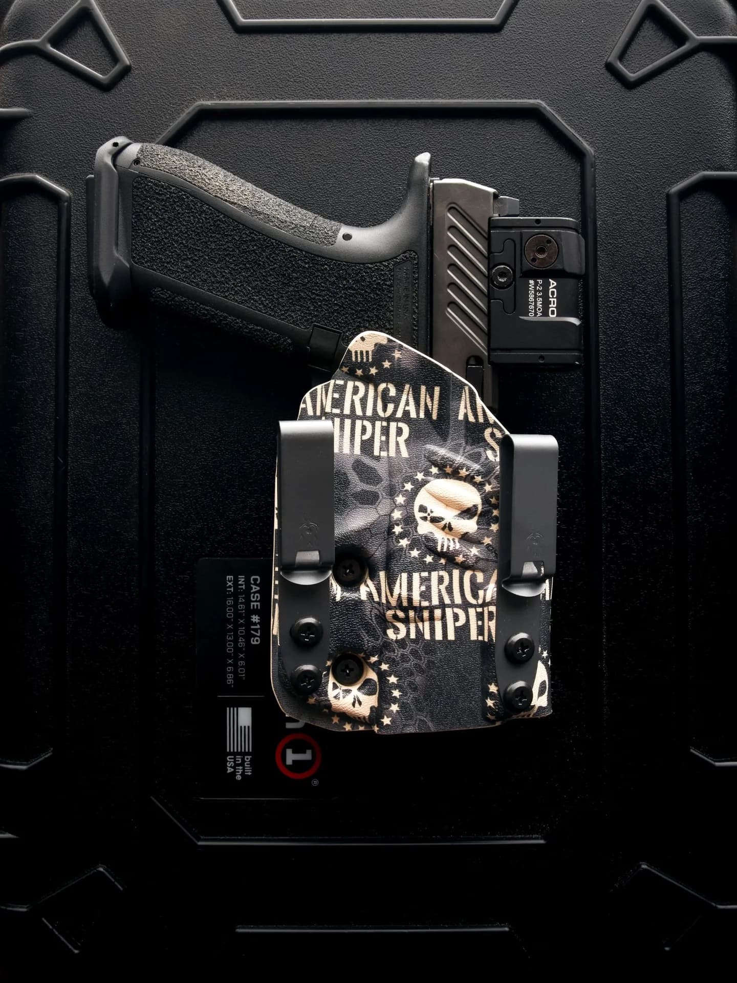An American Sniper IWB holster with an optic cut, on a hard case.