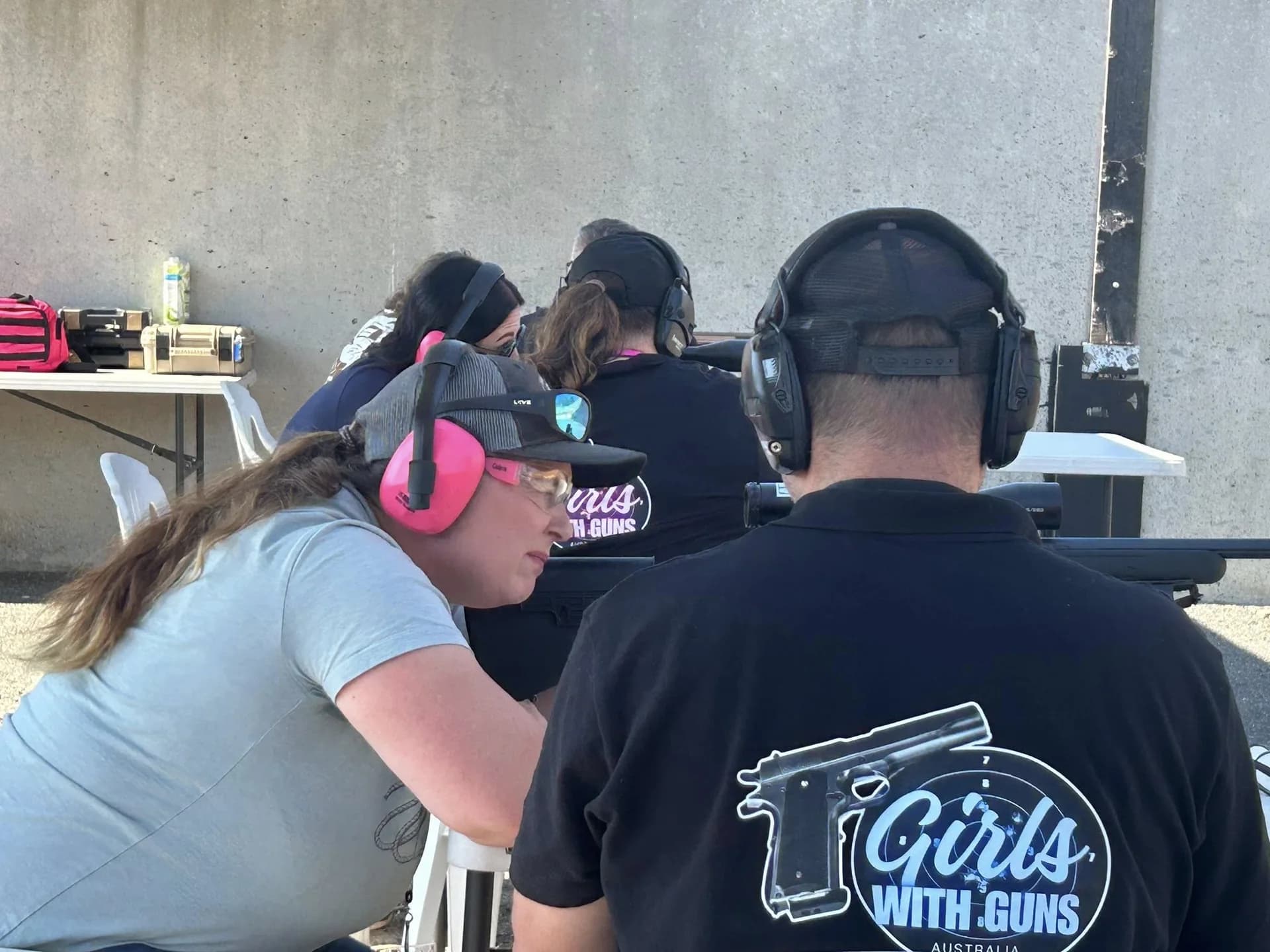 Girls With Guns Australia participants receiving instruction at the range.