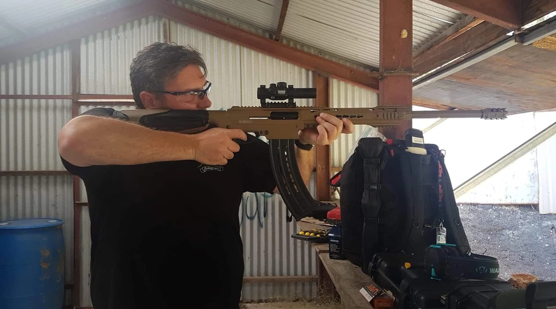 Wayne Lording using a shotgun at a covered range.
